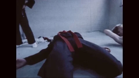 Hap Ki Do students warm up with various exercises of martial art - 1977 Video stock 97905165