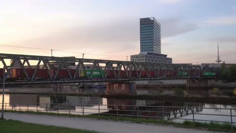 HAPAG-LLOYD containers on freight train passing a bridge  over Weser Bremen. 4k Stock Footage 194543184