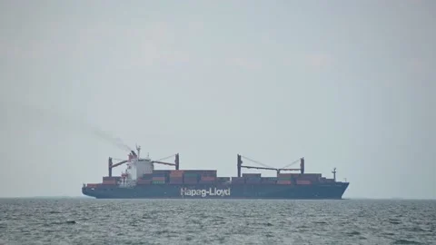 Hapag-Lloyd, large cargo container ship passing by on open sea Stockbeeldmateriaal 158493845