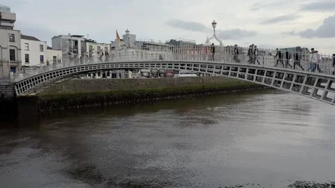 Ha'penny Bridge, Dublin's historic cast iron pedestrian bridge built in 1816, Stock Footage 311771083