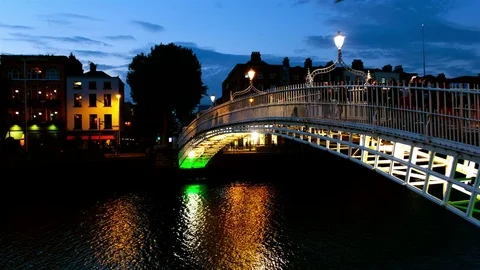 Hapenny Bridge over the River Liffey in Dublin, Ireland at night Stock Footage 78766595
