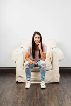 Happily sitting on a couch Foto stock