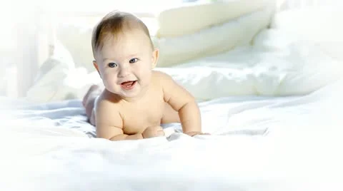Happiness baby funning on the bed Stock Footage 11322604