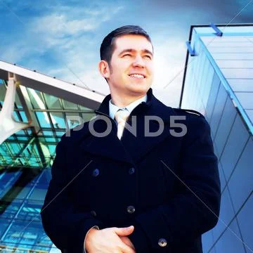 Happiness businessman on the business architecture background Stock Photos