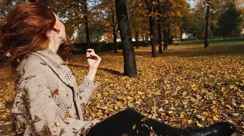 Happiness carefree leisure concept. Redhaired long hair woman relaxing in autumn Stock Footage