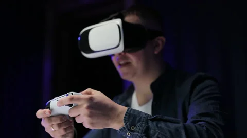 Happiness gamer playing game using VR glasses at home. Caucasian man hold Stock Footage 194553876