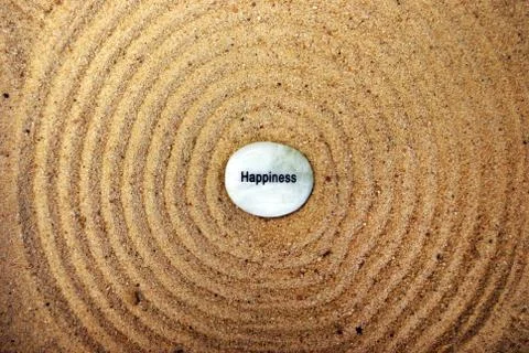 Happiness mood stone on sand zen garden Stock Photos