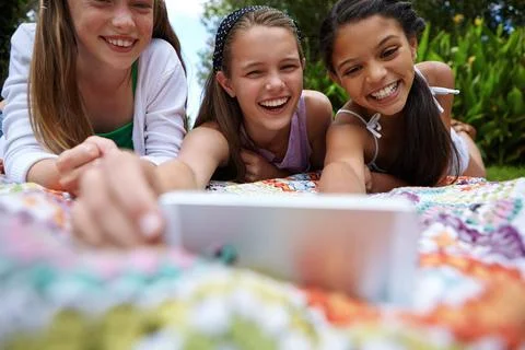 Happiness is only real when shared. a group of young girls taking a selfie Stock Photos