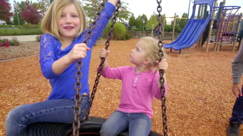 Happiness on tire swing Stock Footage 56797975