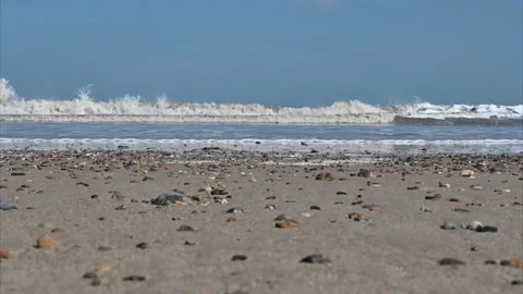 Happisburgh beach in spring with the incoming tide low level camera angle 動画素材 150814848