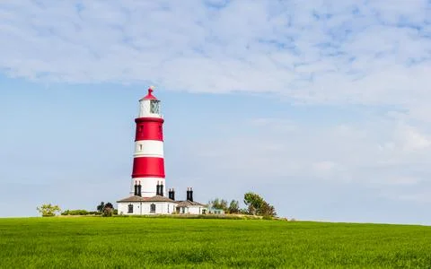 Happisburgh lighthouse under a blue sky Stock Photos