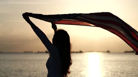 Happy 4th of July Independence Day. Women holding USA American flag waving Stock-Footage 156830473