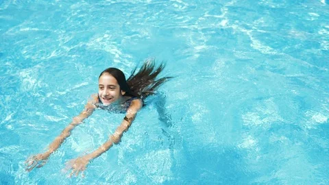 Happy active teen girl in the swimming p... | Stock Video | Pond5