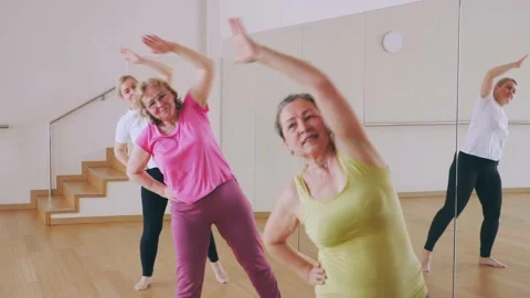 Happy adults training swing steps at dance class Stock Footage 157429266