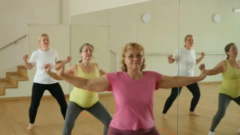 Happy adults training swing steps at dance class Stock Footage 221211506