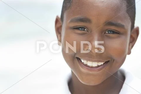 Happy african american boy on beach Stock Photos
