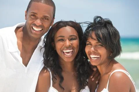 Happy african american family on beach Stock Photos