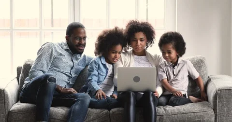 Happy african american family watching video on computer. Stock Footage
