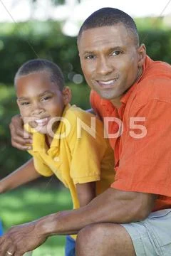 Happy african american father and son family outside Stock Photos