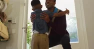 Happy African American Son Welcoming And Embracing Father Coming Home Stock Footage