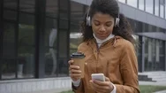 Happy African American Woman In Headphones Walking Stock Footage