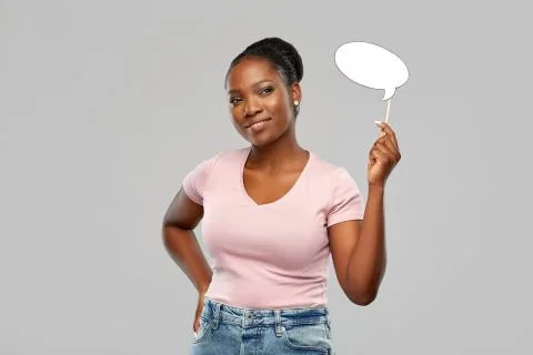 Happy african american woman holding speech bubble Stock Photos