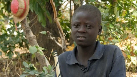 A Happy African Boy Talks to the Camera co Stock Footage 115730793