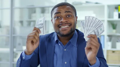 Happy African Businessman Showing Money at Camera and Yelling Stock Footage
