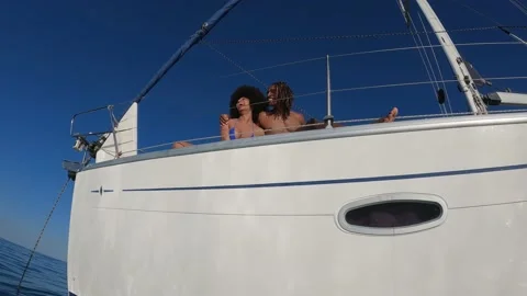 Happy african couple enjoy summer day on sail boat Stock Footage 199238053