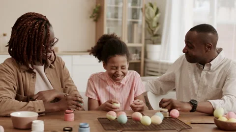 Happy African Family Tapping Easter Eggs Stock Footage 148734892