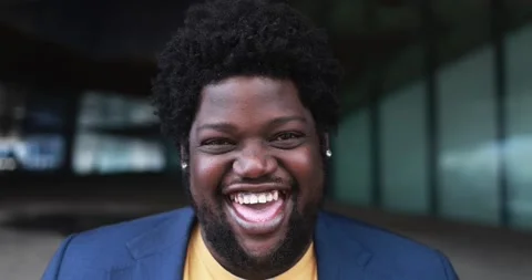 Happy african plus size man smiling on camera outdoor Stock Footage 175791593