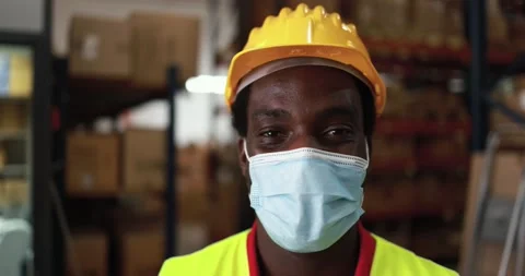 Happy african worker man inside delivery box warehouse Stock Footage 145434593