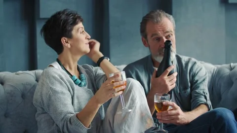 Happy aged couple drinking wine Stock Footage 147686411