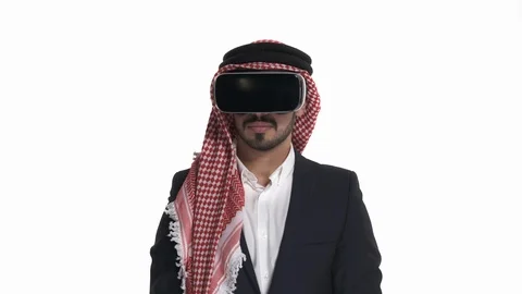 Happy amazed Arab bearded man using VR headset and exploring another world, Stock Footage 125829838