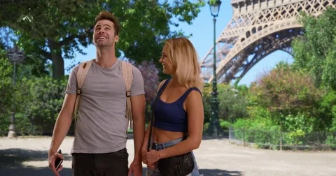 Happy and attractive couple using map on smartphone in Paris Stock Footage 85326188