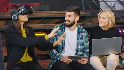 Happy and charismatic multiethnic three students enjoying the time on the Stock Footage 122223091