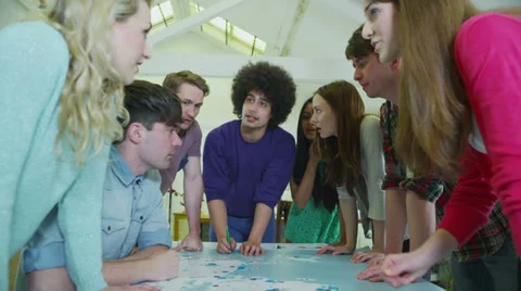 Happy and diverse group of students or young business team working on a project Stock Footage 28779366
