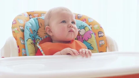 A happy and hungry child eats mashed potatoes with fresh vegetables Video stock 72565315