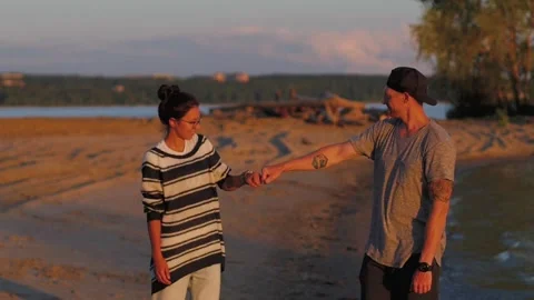 Happy and Romantic couple having fun on the beach at sunset. young couple 스톡 동영상 140776192