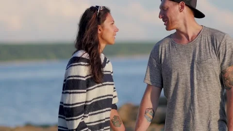Happy and Romantic couple having fun on the beach at sunset. young couple Stockbeeldmateriaal 140776883