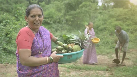 A happy and smiling female farmer in traditional saree Stock Footage