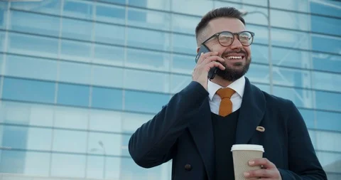 Happy and Smiling Man Having Pleasant Conversation on his Smartphone. Speaking Stock-Footage 124660049