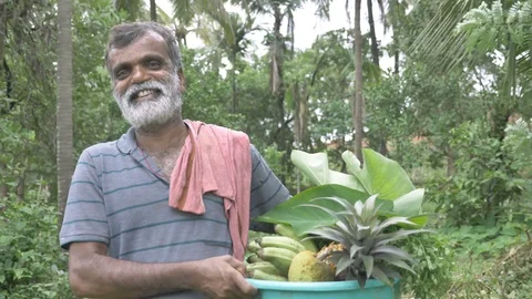 A happy and smiling middle aged bearded male farmer is smiling and looking Stock Footage 115483770