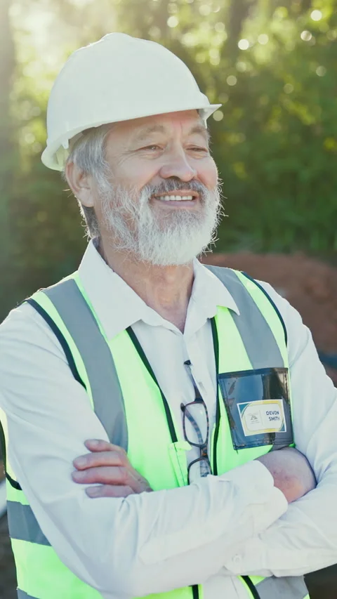 Happy, architect and man at construction site with arms crossed, hard hat and Stock Footage 340450194