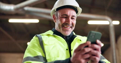 Happy, architect and man with phone on construction site, chat and communication Stock Footage 337987772