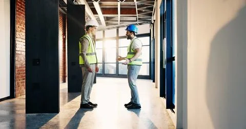 Happy, architect and men in building, discussion and planning for property .. 库存照片