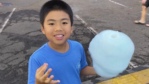 Happy Asian Boy Smiles Eats Cotton Candy At Carnival Fair Outdoor Young Child Stock-Footage 237676356