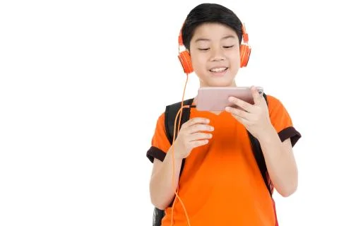 Happy asian boy using cell phone . Stock Photos