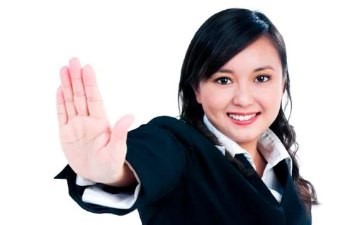 Happy Asian businesswoman indicating stop gesture Stock Photos
