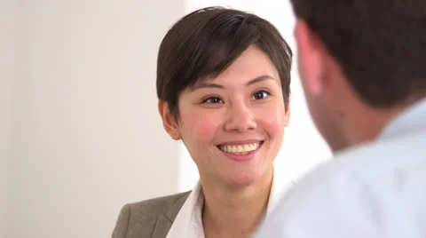 Happy Asian businesswoman talking in a meeting Stock Footage